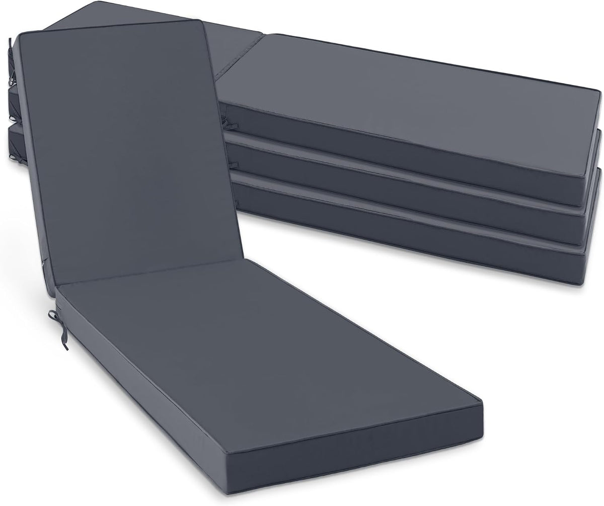 Stack of three charcoal chaise cushions beside one laid out with backrest propped upright.
