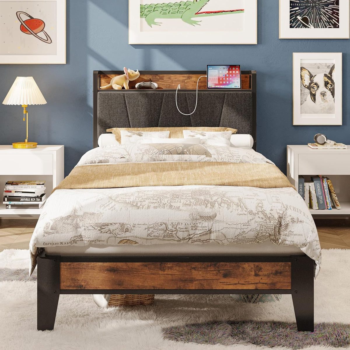 Centered bed image with padded gray headboard, wood storage shelf, and rustic brown front rail on a plush rug.