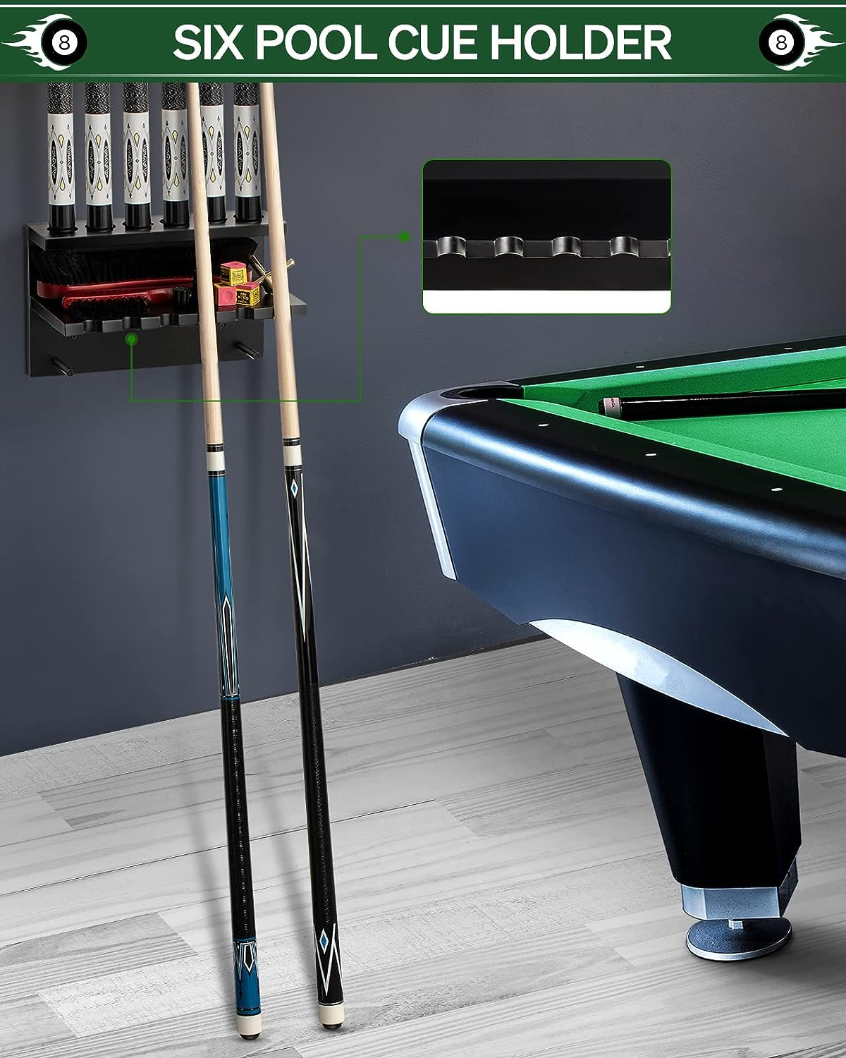 Wall-mounted black cue rack beside a green pool table with two cues leaning against it