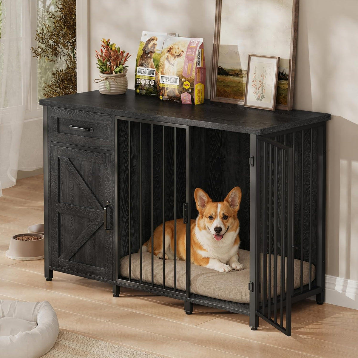 Black wood dog crate with vertical bars, open door and a corgi lying on a cushion inside.