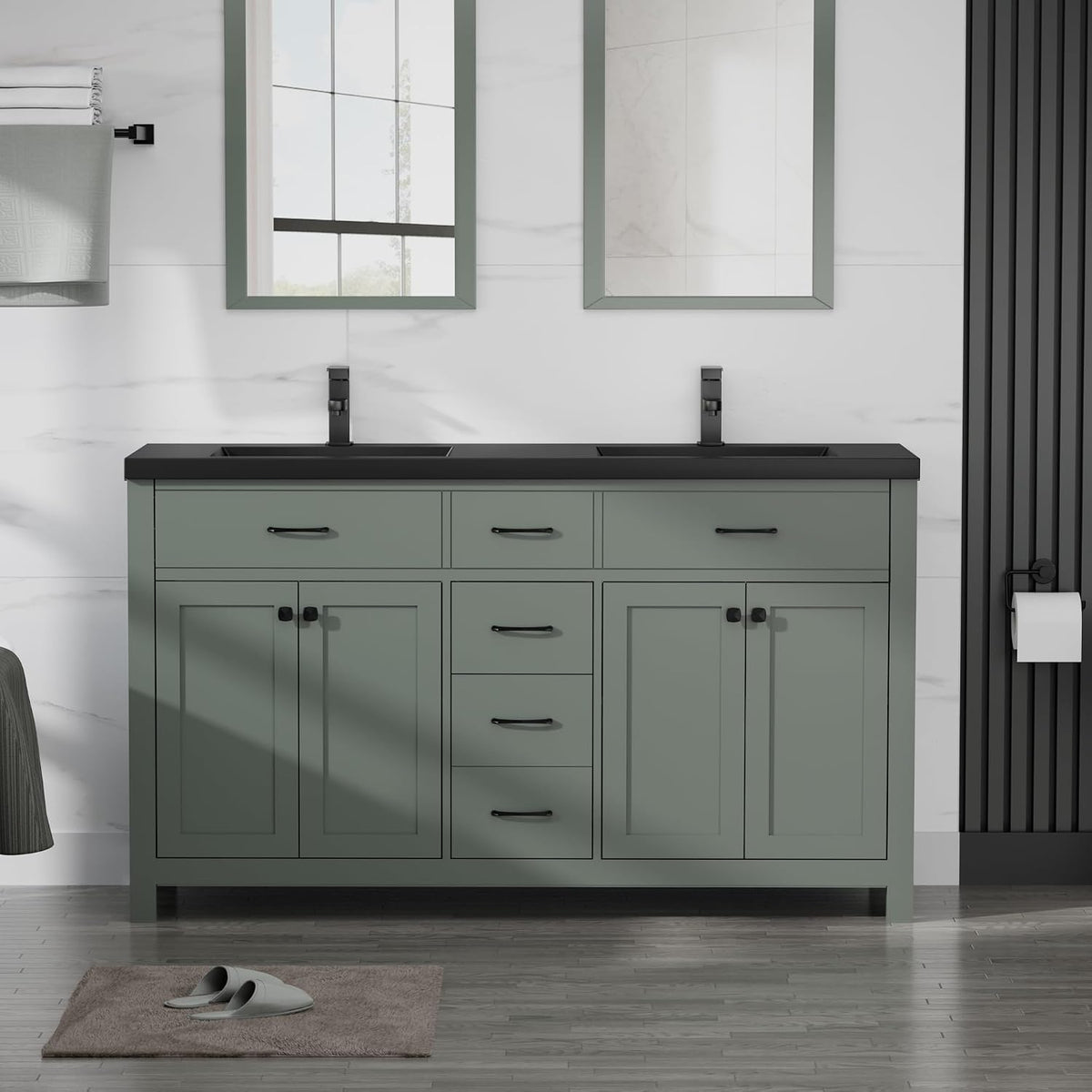 Straight-on shot of a sage green double-sink vanity with a black countertop and black hardware.