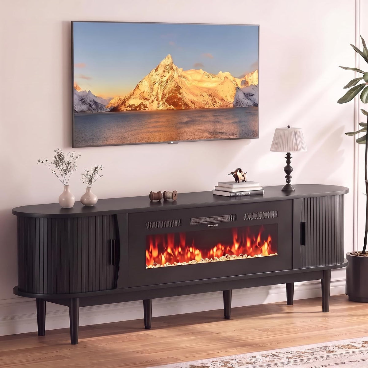 Front view of the console in a black finish with lamp and vase styling on top