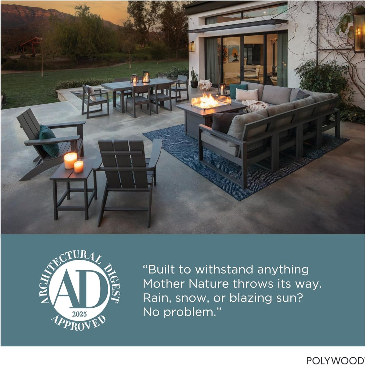 Outdoor patio at dusk with two navy Adirondack chairs, side table with candles, and distant dining set around a fire table