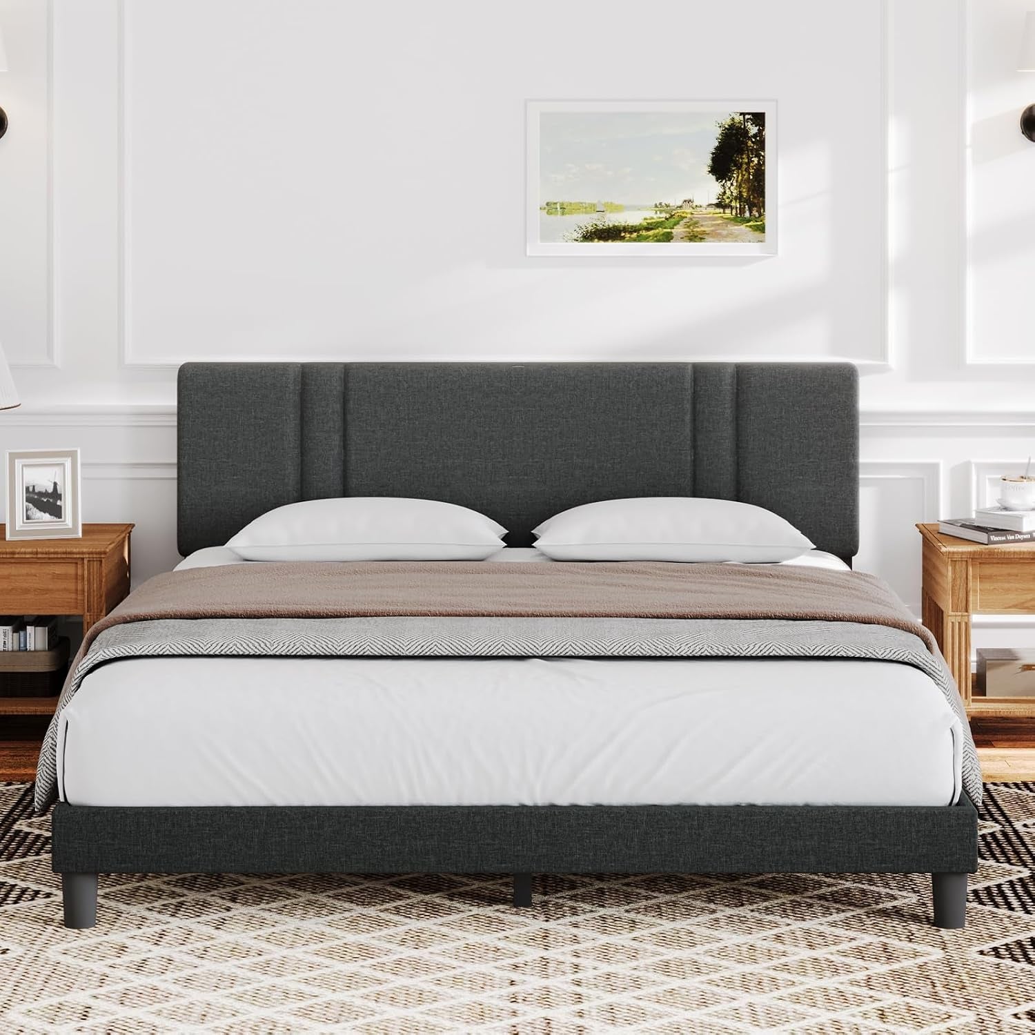 Front view of a charcoal upholstered bed with a wide headboard and vertical panel accents.