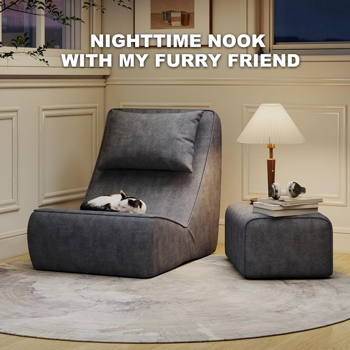Single dark-gray chaise with matching ottoman, bedside lamp and a small sleeping cat on the seat.