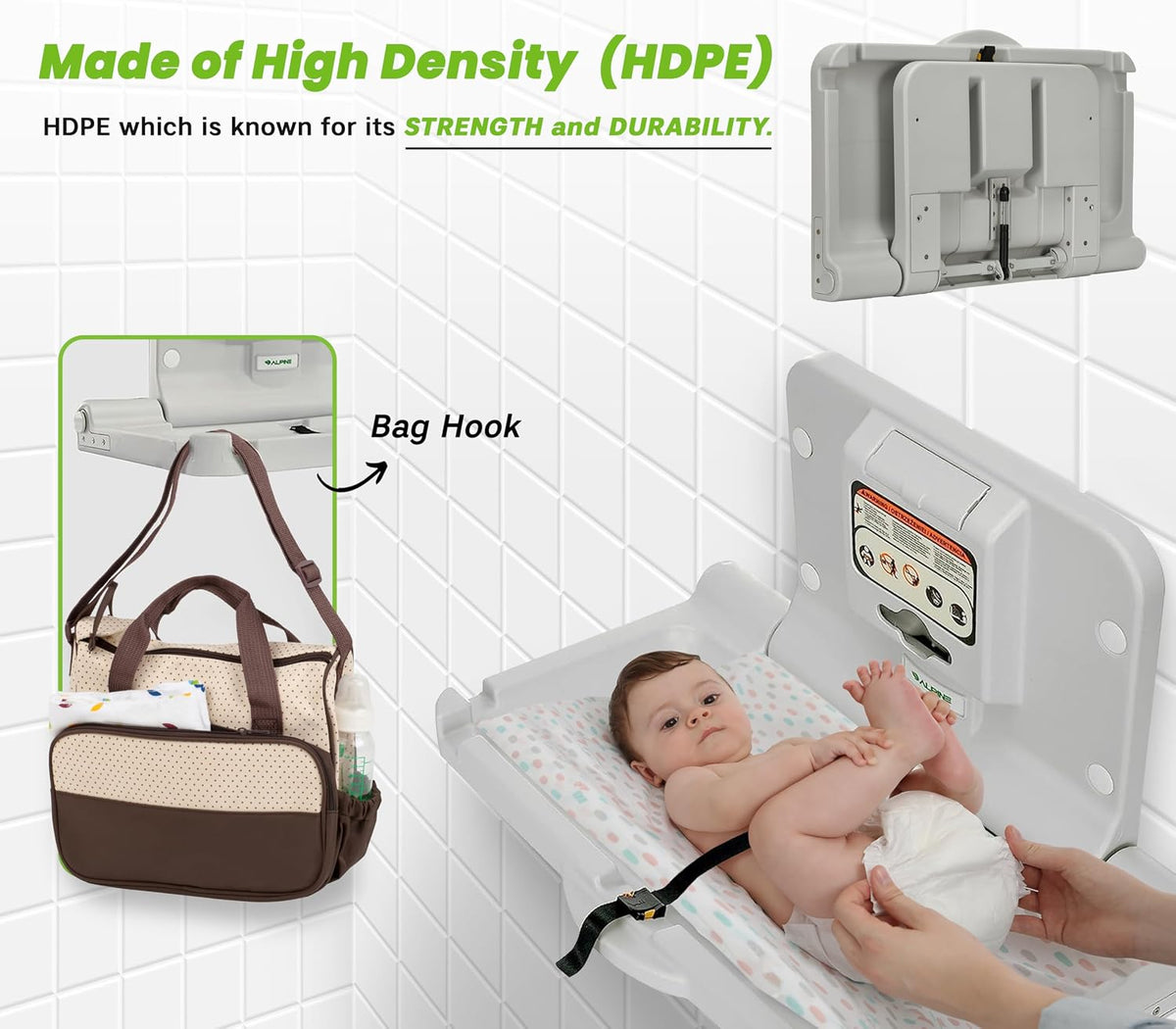 Changing station mounted on a tiled wall with a diaper bag hanging from the bag hook and hands adjusting a baby on the pad.