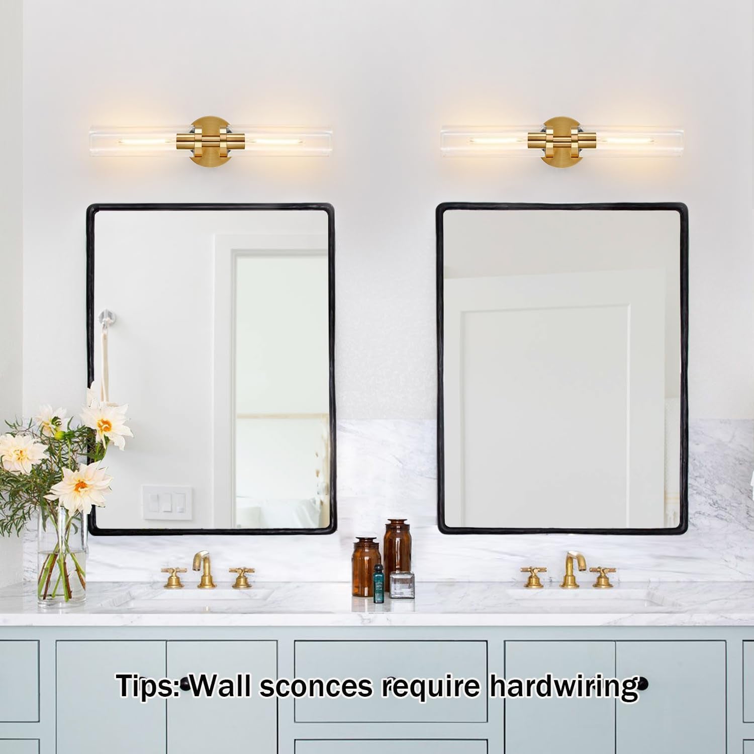 Double bathroom vanity with two horizontal gold wall sconces above matching mirrors