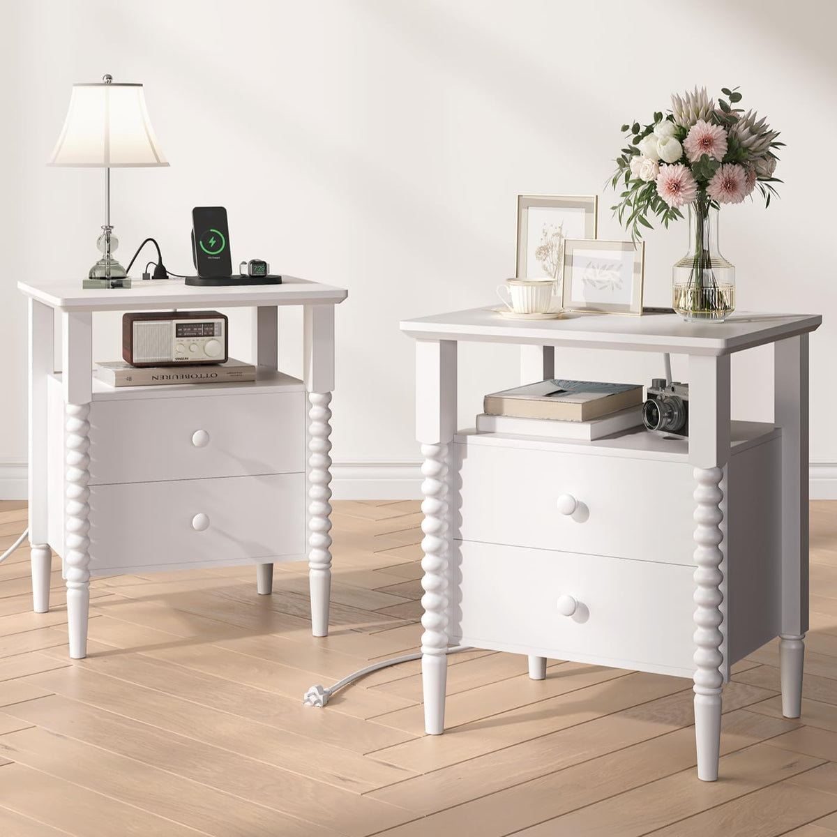 Two white fluted nightstands side by side in a bright room, each with an open shelf and two drawers.