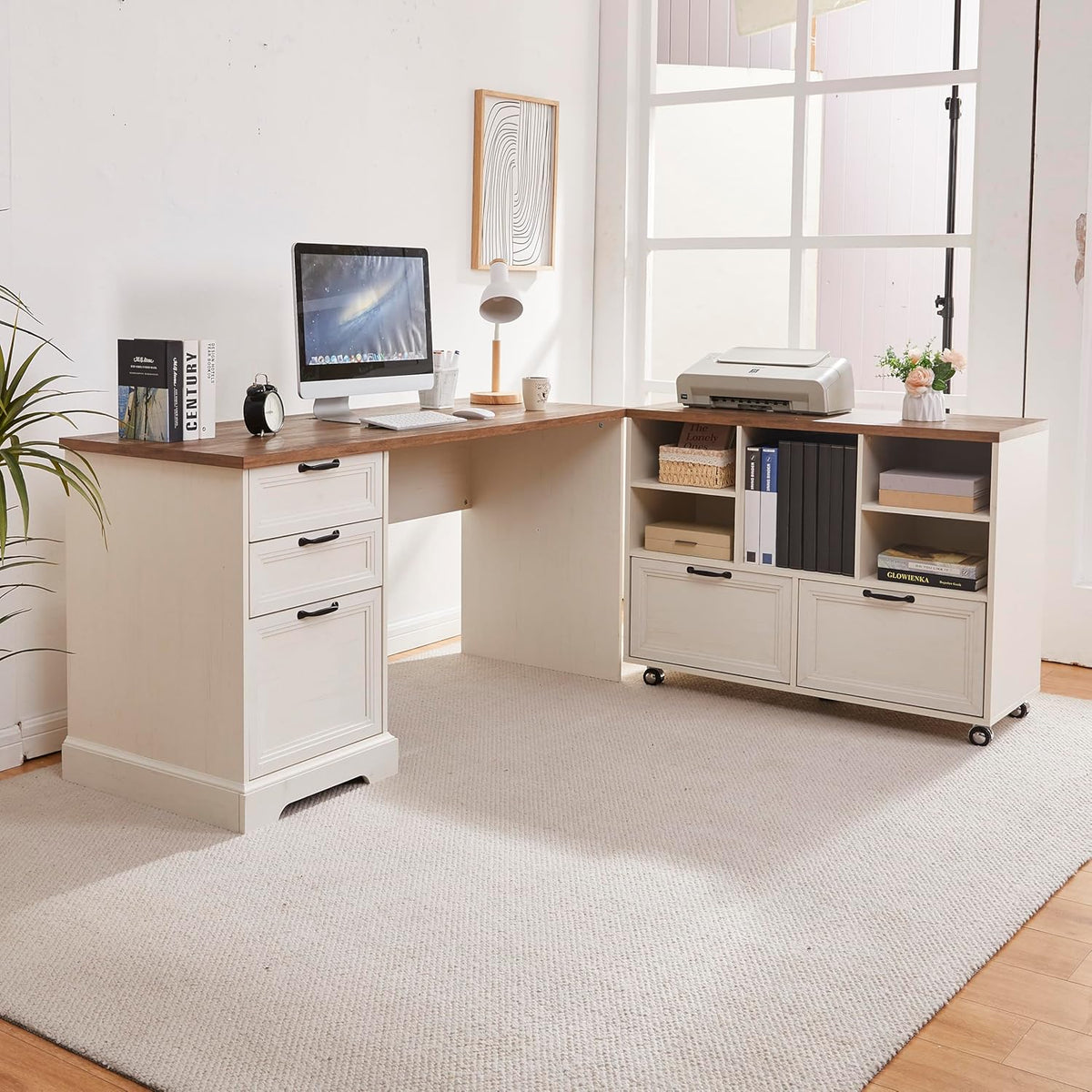 Off-white and walnut L-shaped executive desk with drawers and mobile cabinet shown in a bright home office angle view