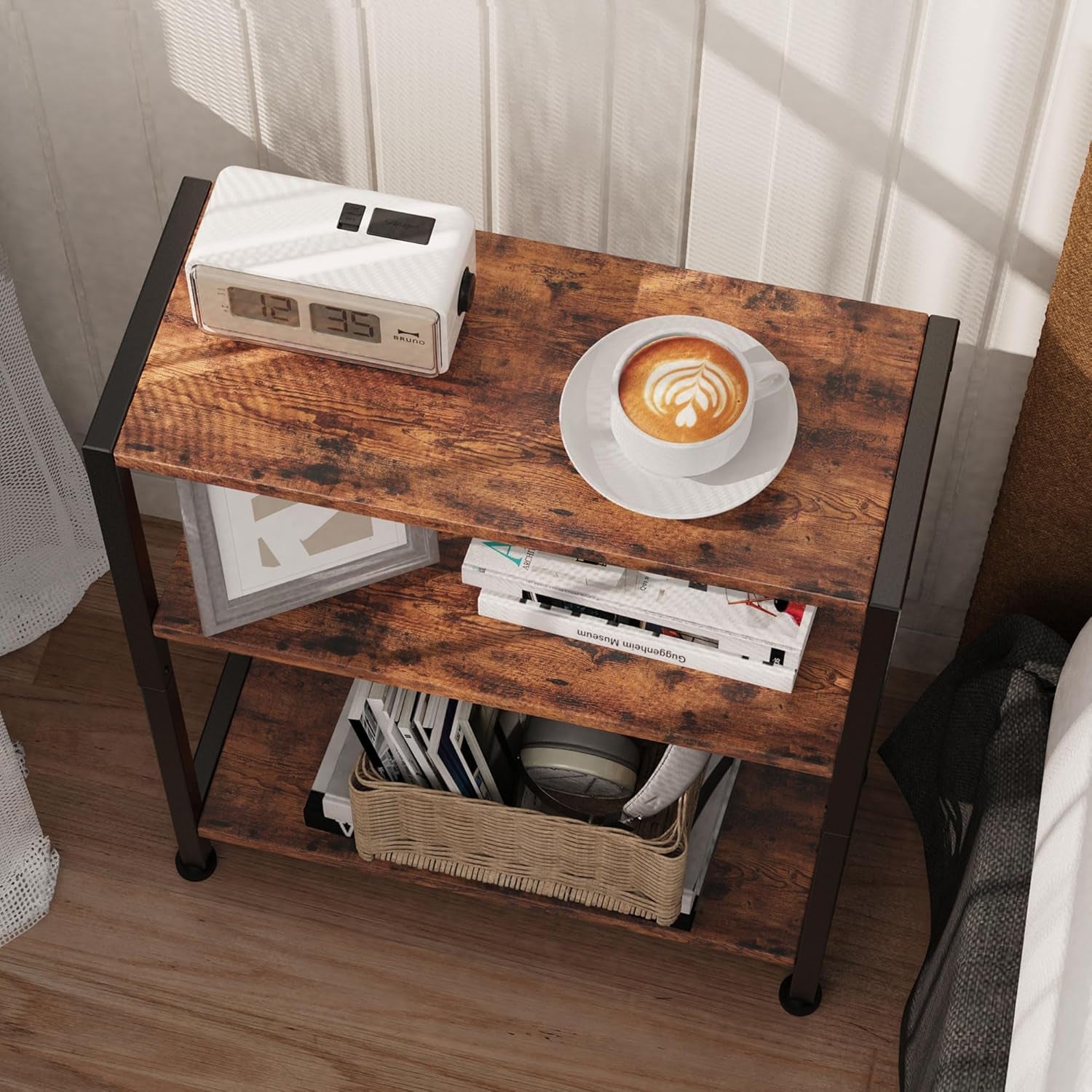 Top-down view of the narrow three-shelf table showing wood-grain top shelf with clock and coffee cup