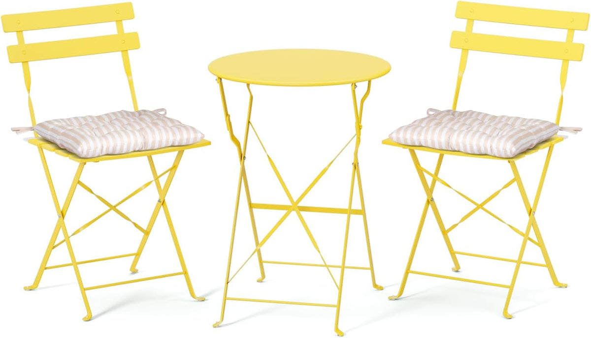 Yellow folding bistro table flanked by two yellow folding chairs with beige-striped tufted seat cushions.