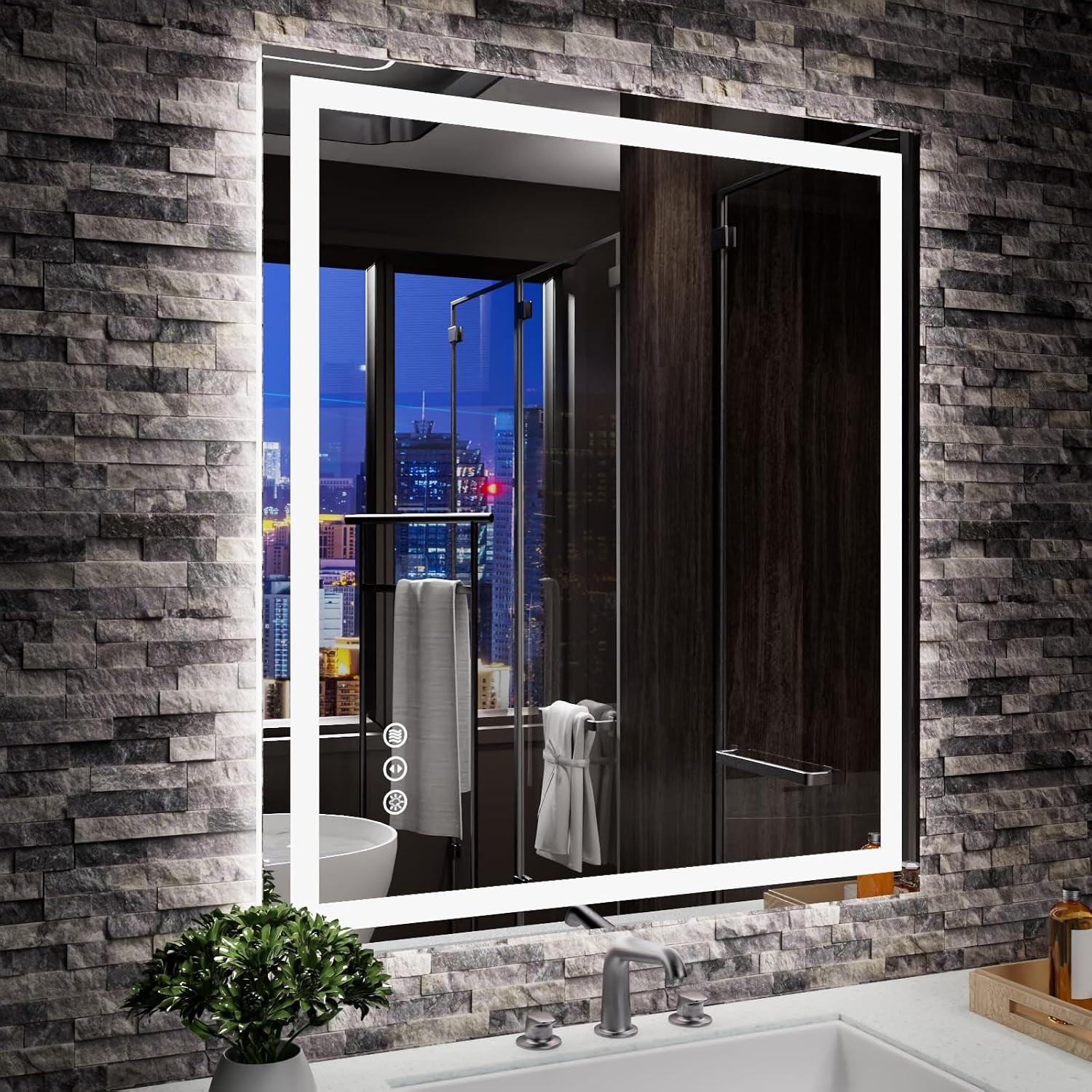 LED mirror inset in a textured gray stone wall, reflecting a shower and city lights above a chrome faucet.