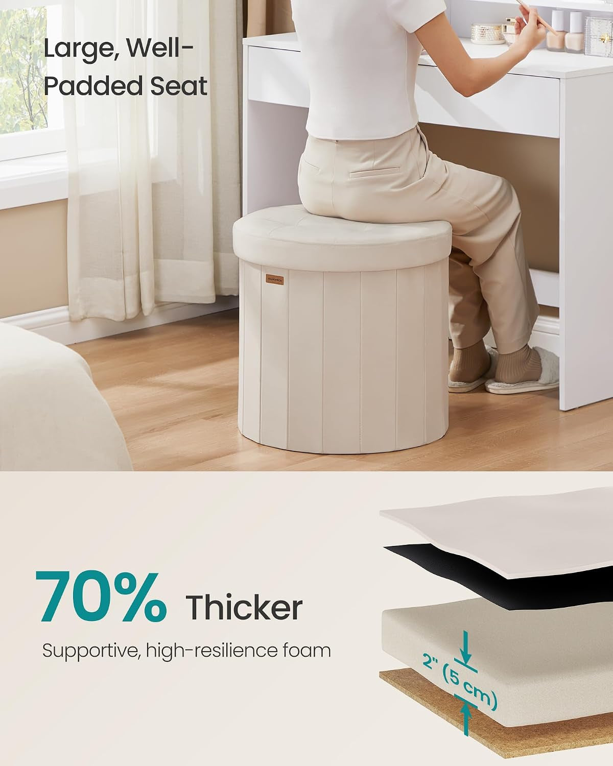 Person seated on the ottoman at a vanity demonstrating the padded seat in a room setting