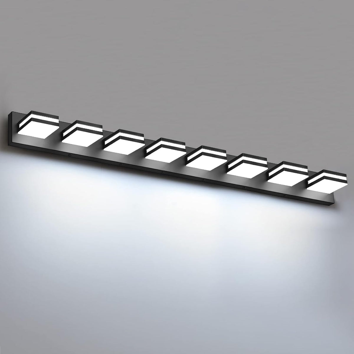 Close angled view of a black LED bathroom vanity light with eight bright square modules.
