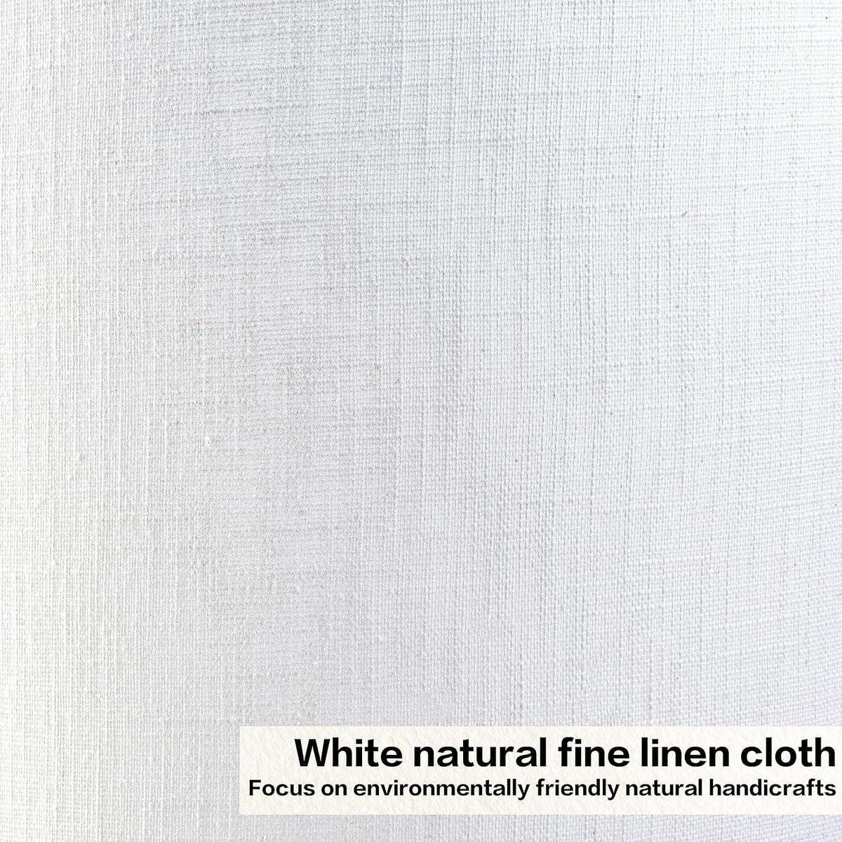 Detailed close-up of white linen cloth texture on a drum lampshade showing visible weave and fibers.