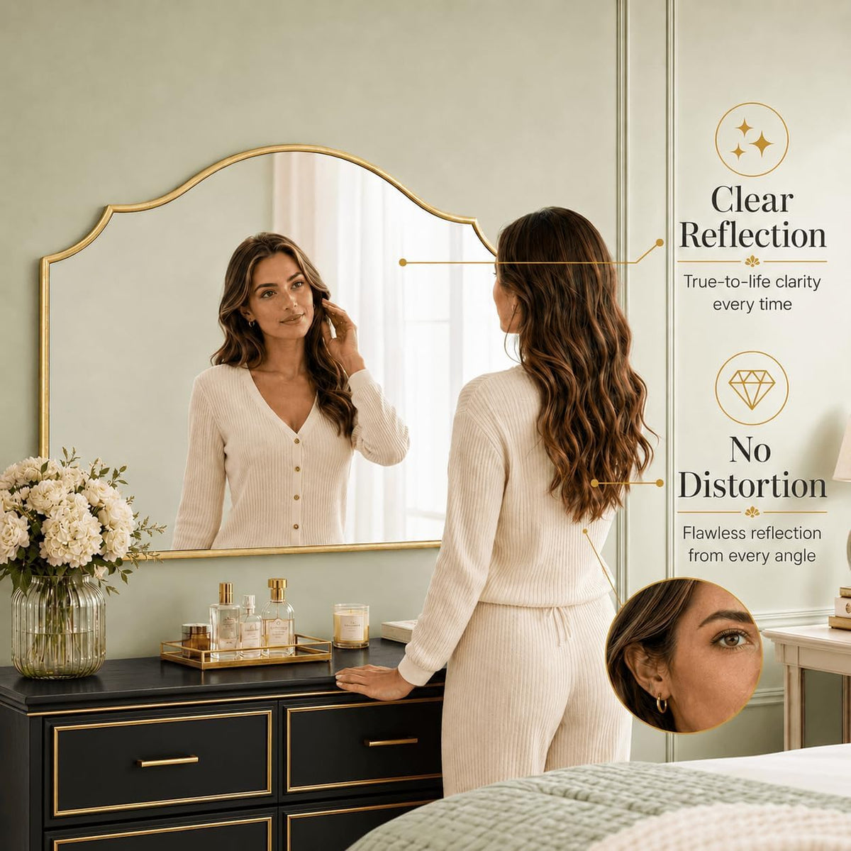 Gold scalloped mirror reflecting a woman standing at a dresser with toiletries and bedroom styling visible