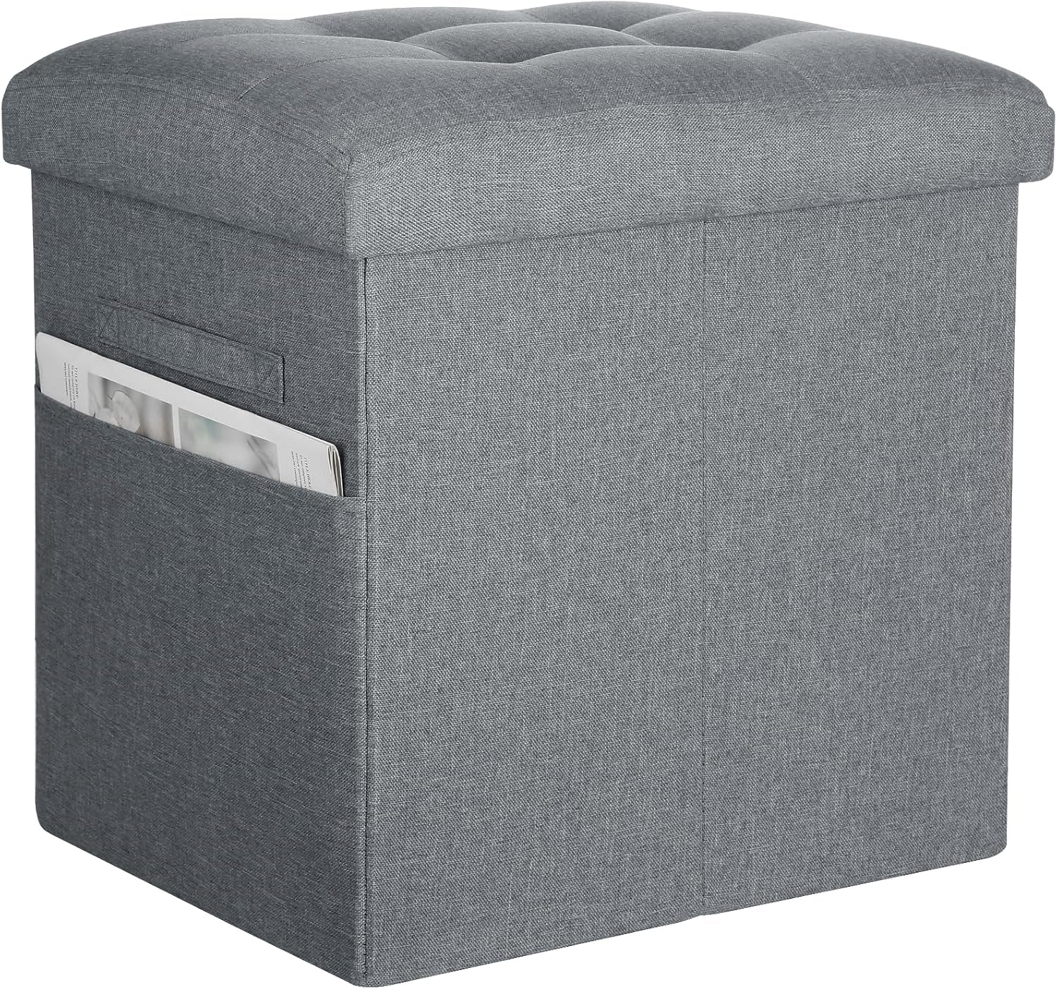 Fabric storage ottoman shown from an angle, tufted padded lid and visible outer side pocket with a magazine