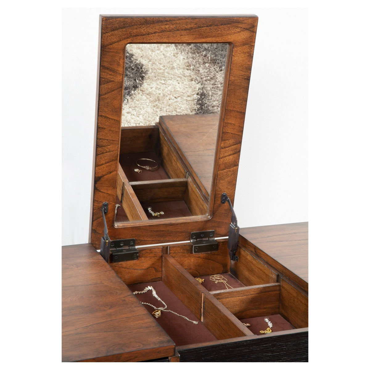 Close-up of the raised mirror and divided storage compartments beneath the top