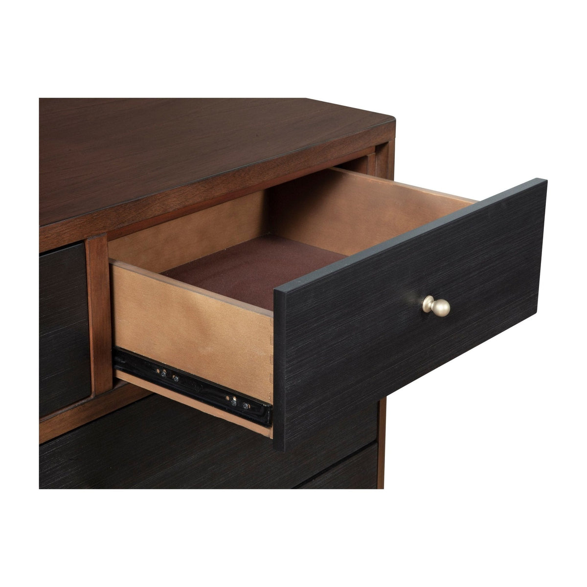 Close-up of an open dresser drawer and its dark front