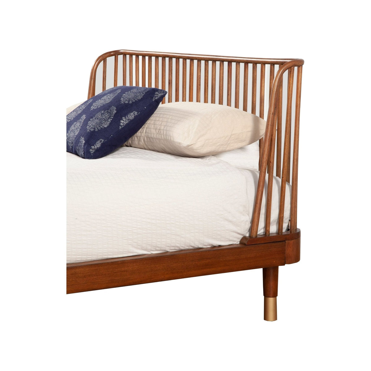 Close angled view of the bed's curved slat headboard and side rail