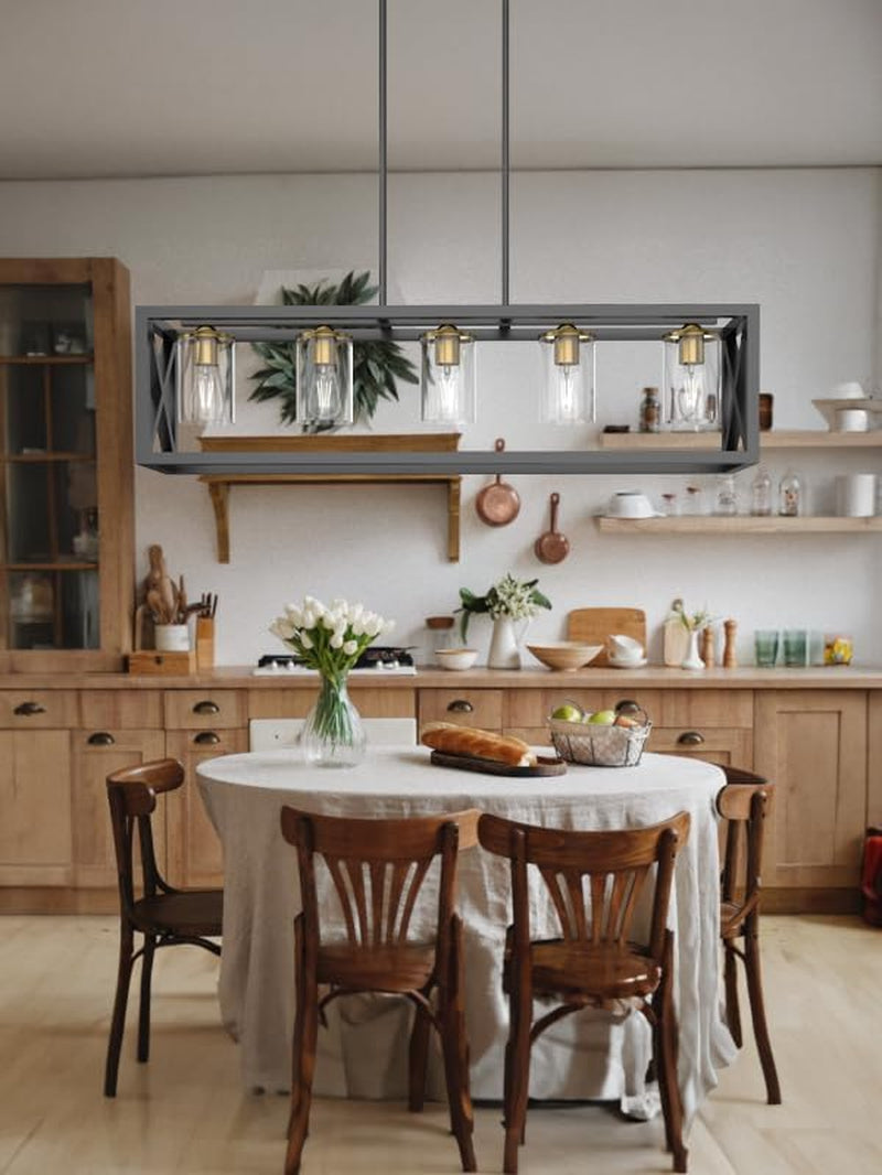 Dining room scene with a rectangular chandelier hanging over a round table and four wooden chairs.