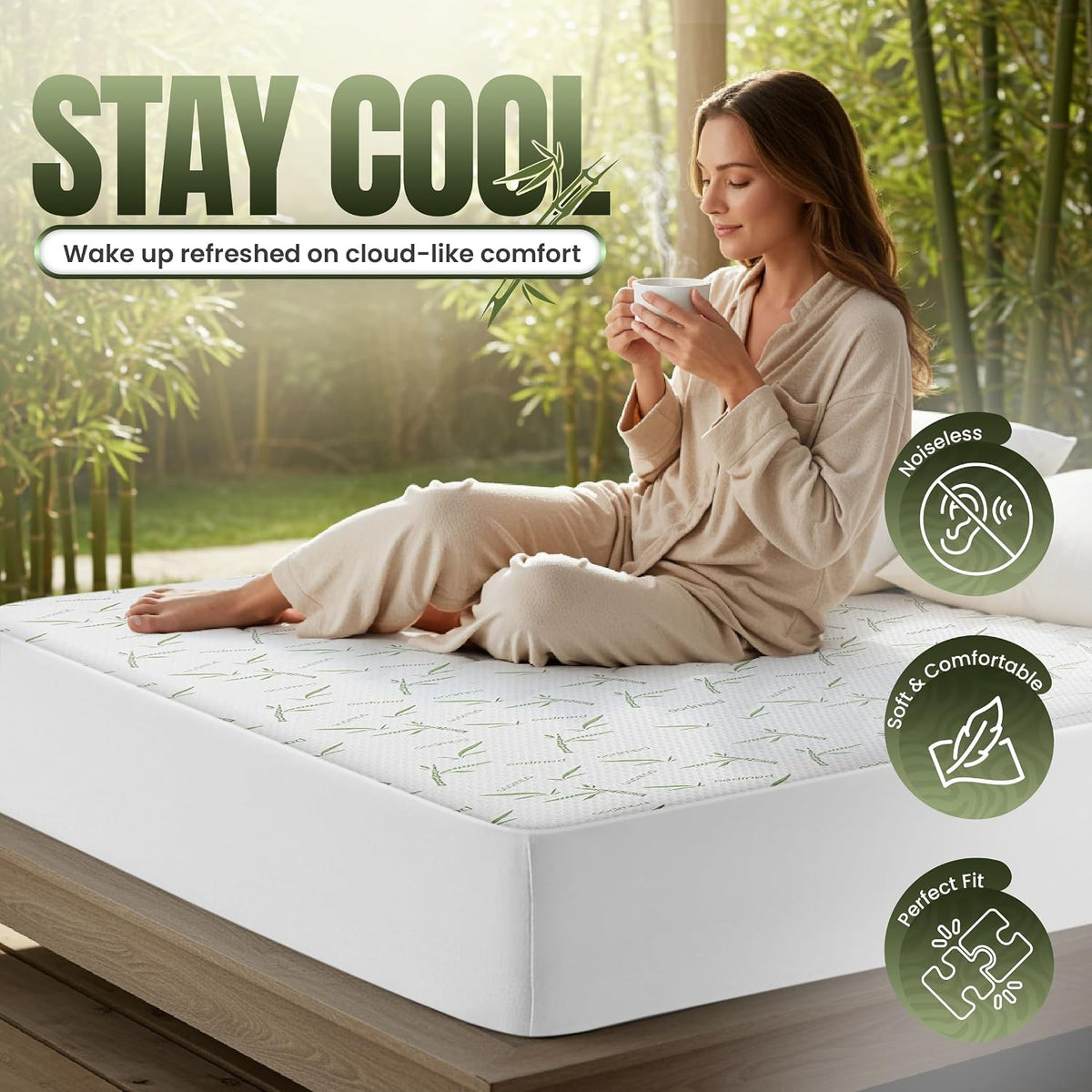 Woman sitting on a bed holding a cup on top of a fitted bamboo-print mattress protector