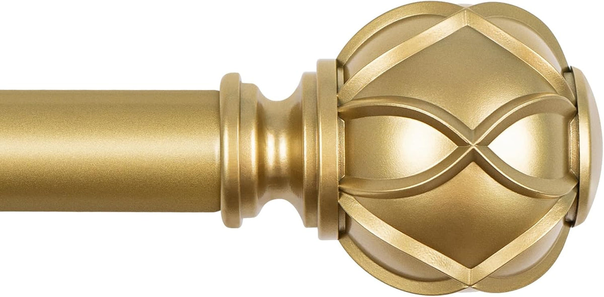 Close-up of a gold curtain rod finial and matching rod section