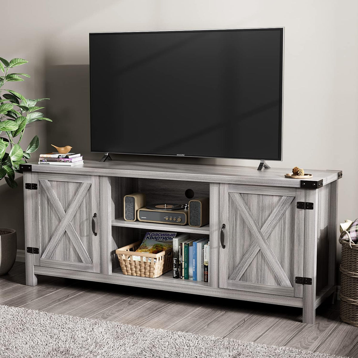 Gray wash 58-inch barn-door TV stand front-left angled view with TV on top and open center shelves.