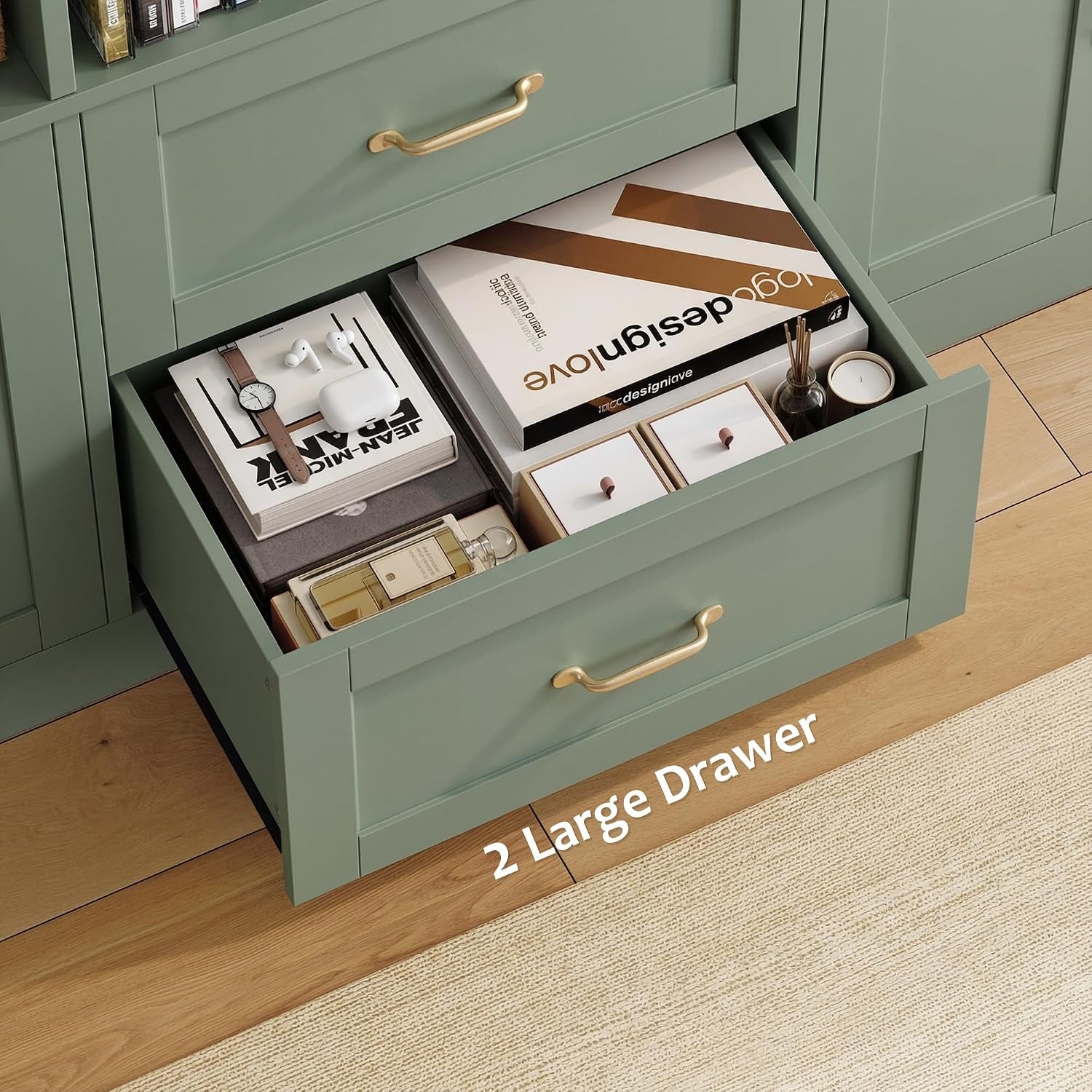 Close-up of an open green lower drawer filled with books and small accessories