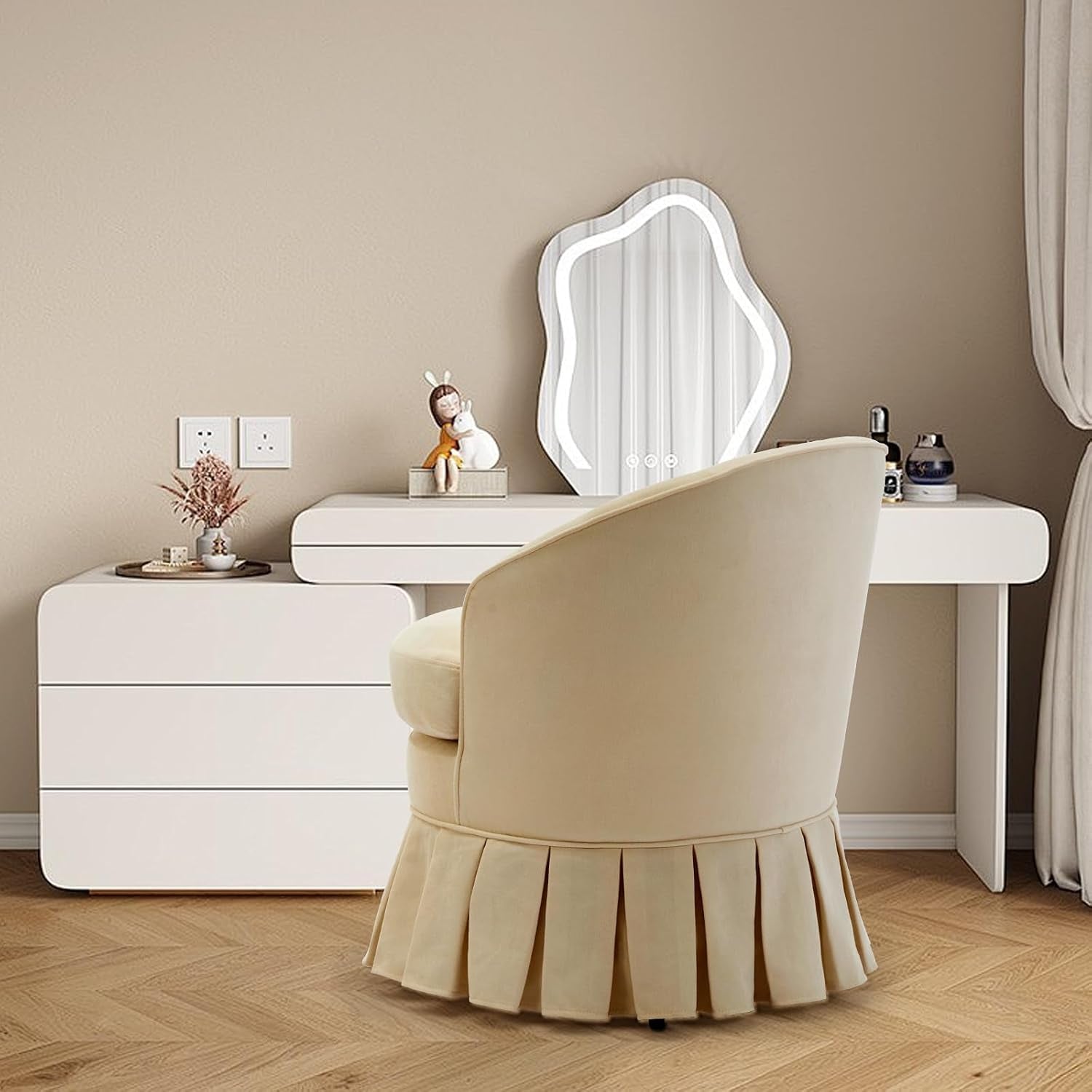 Two beige barrel chairs arranged by a window in a bright living area