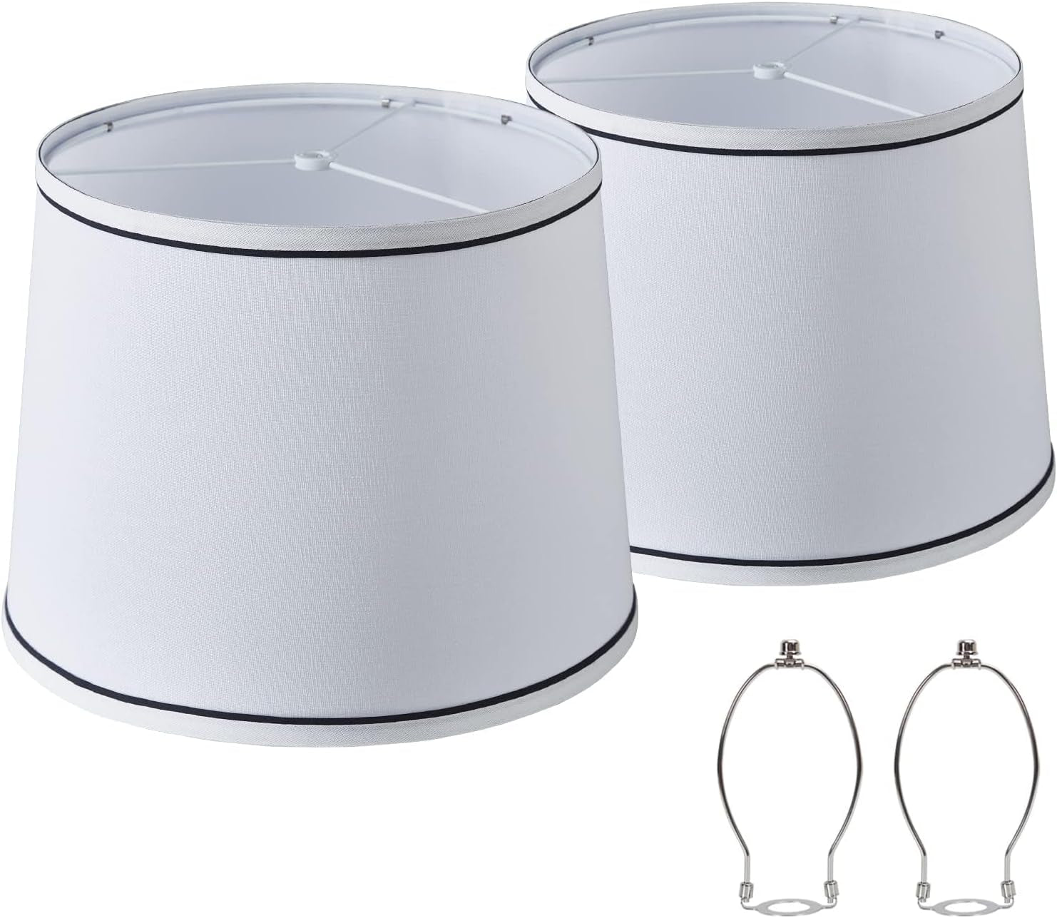 Two white tapered shades with thin black top and bottom trim shown alongside two metal harp fittings