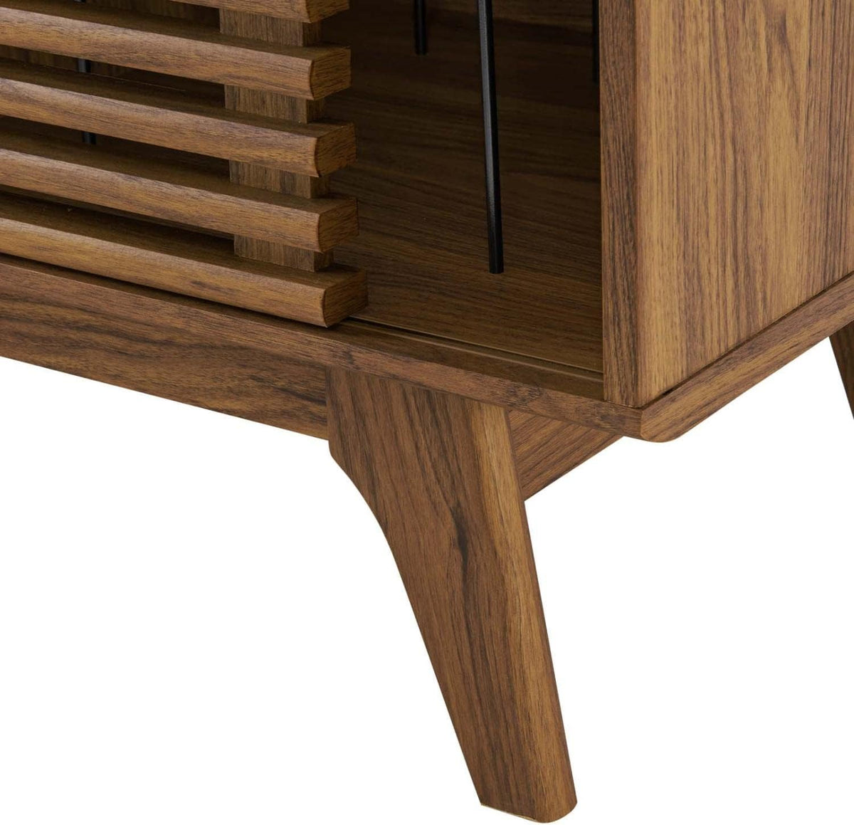 Close-up of the cabinet corner showing slatted front, inner metal dividers and tapered wood leg detail.