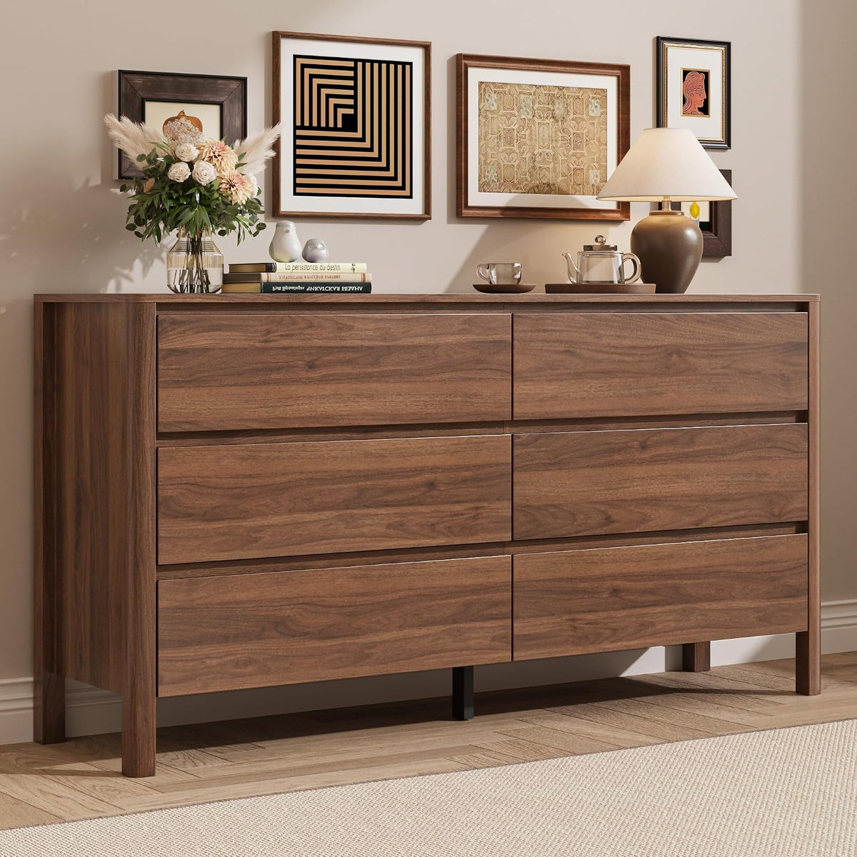Walnut finish 6-drawer dresser front view with lamp, framed art and a floral vase on top