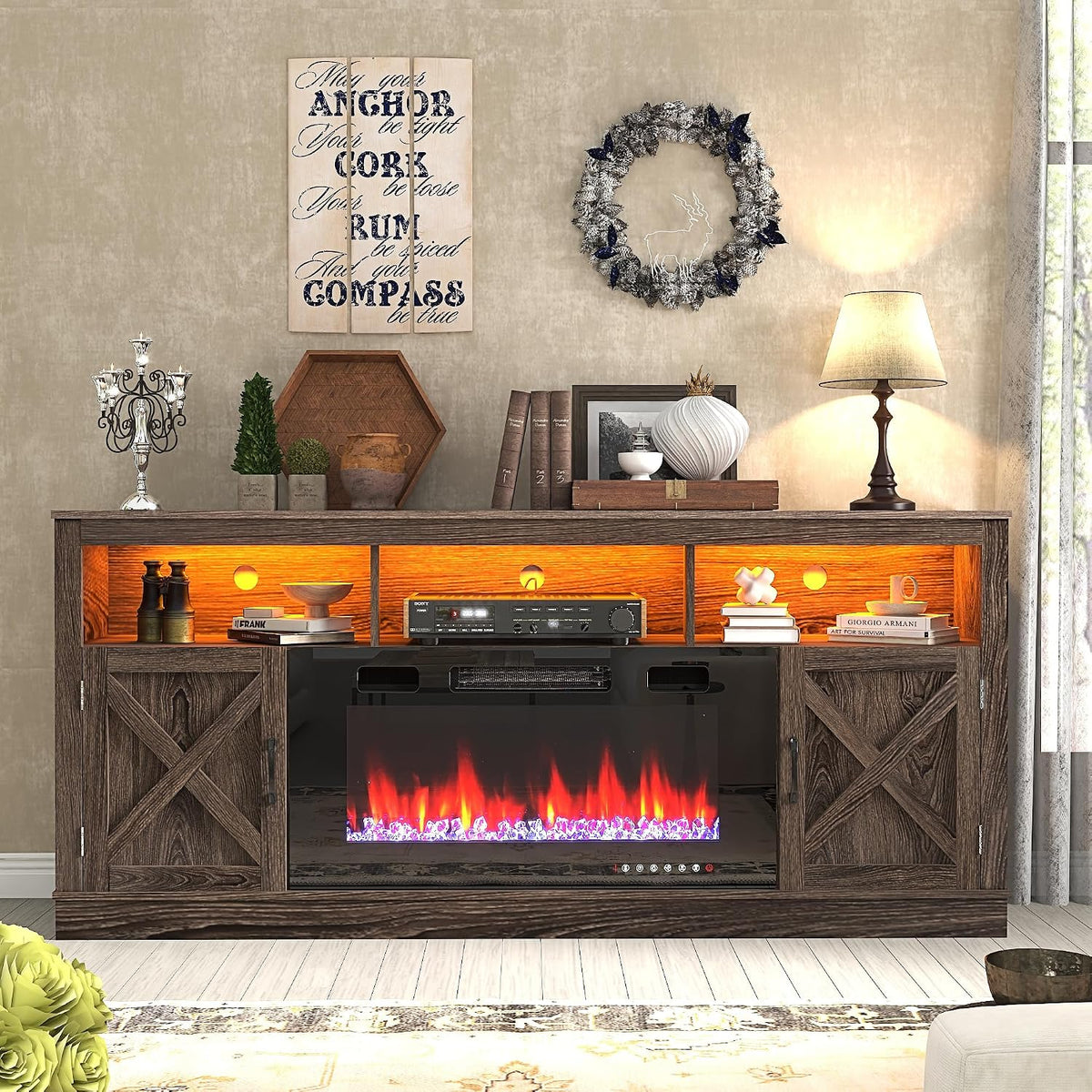 Dark brown wood TV stand front with glowing upper cubbies, barn-door cabinets and colorful flame effect