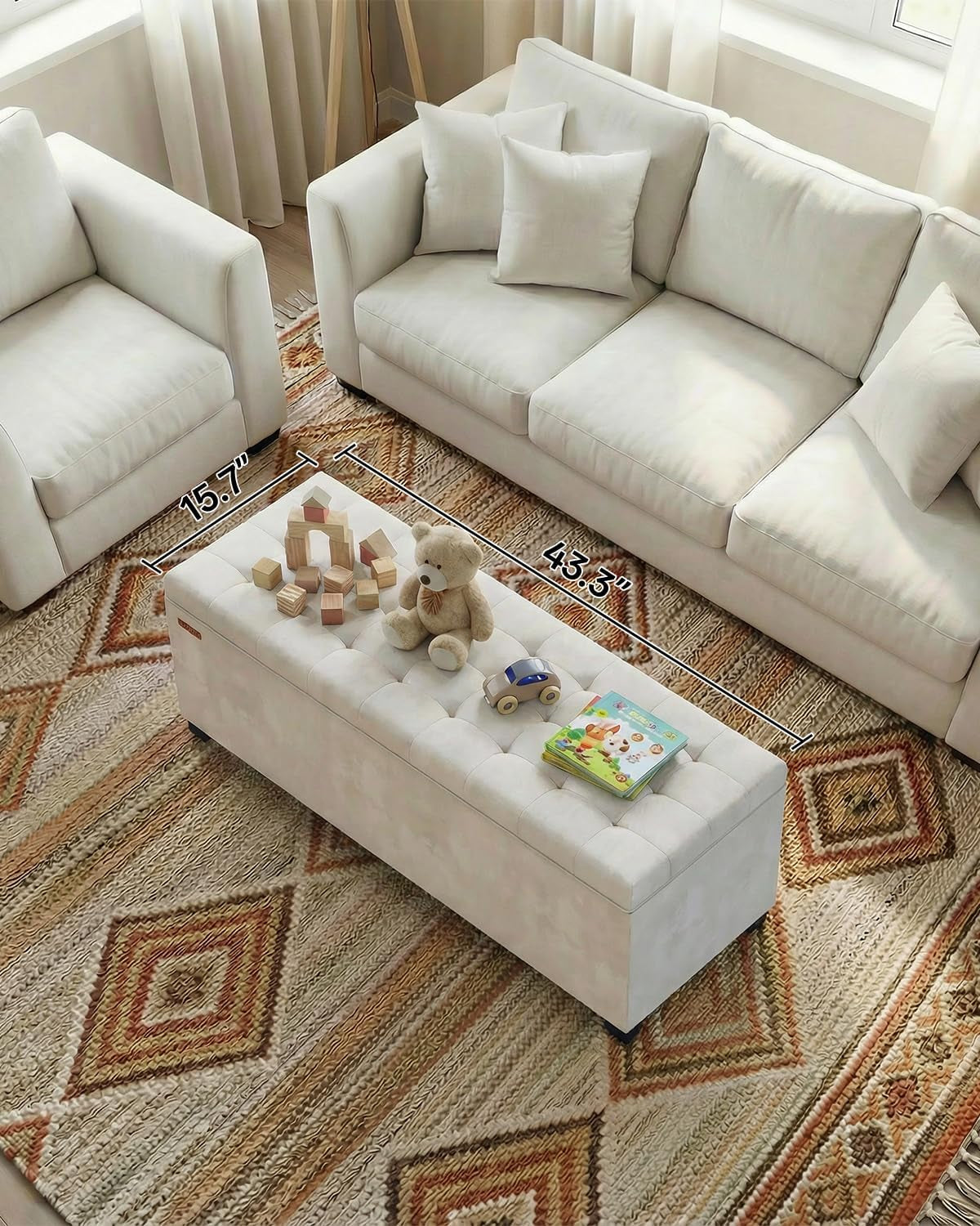 Overhead living room view of tufted white bench with toys on top and dimension overlays showing length and depth