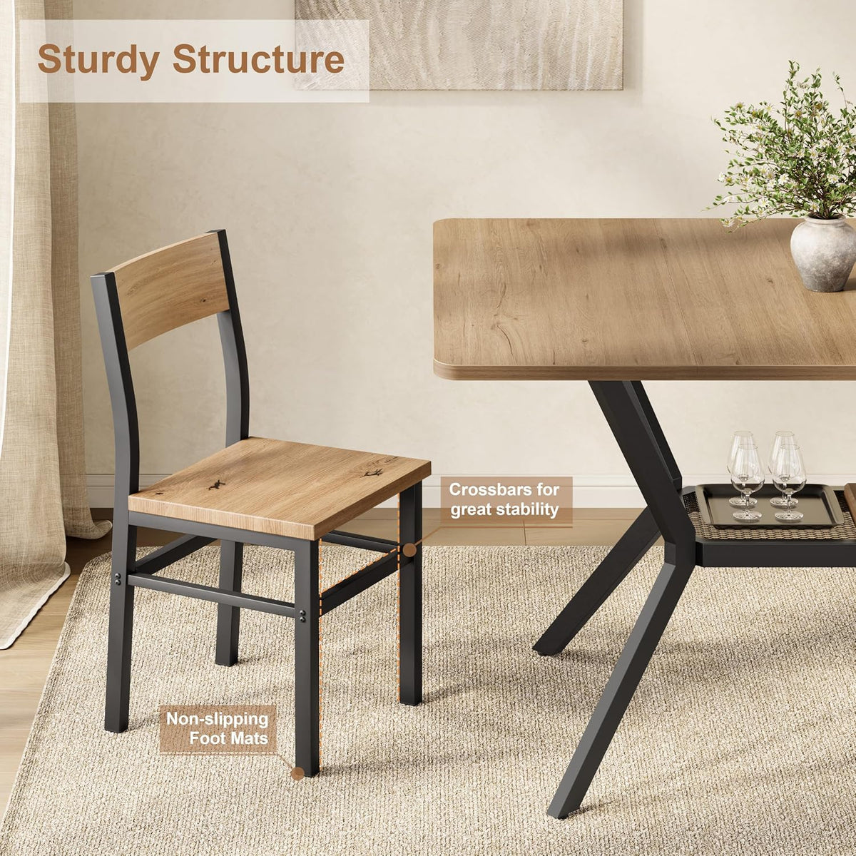 Close-up of chair and table corner showing crossbars, non-slip foot pads, and black metal X-base