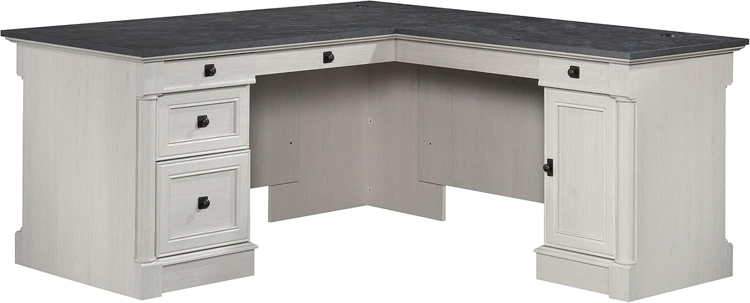 Isolated L-shaped desk in a light painted finish with dark top on white background