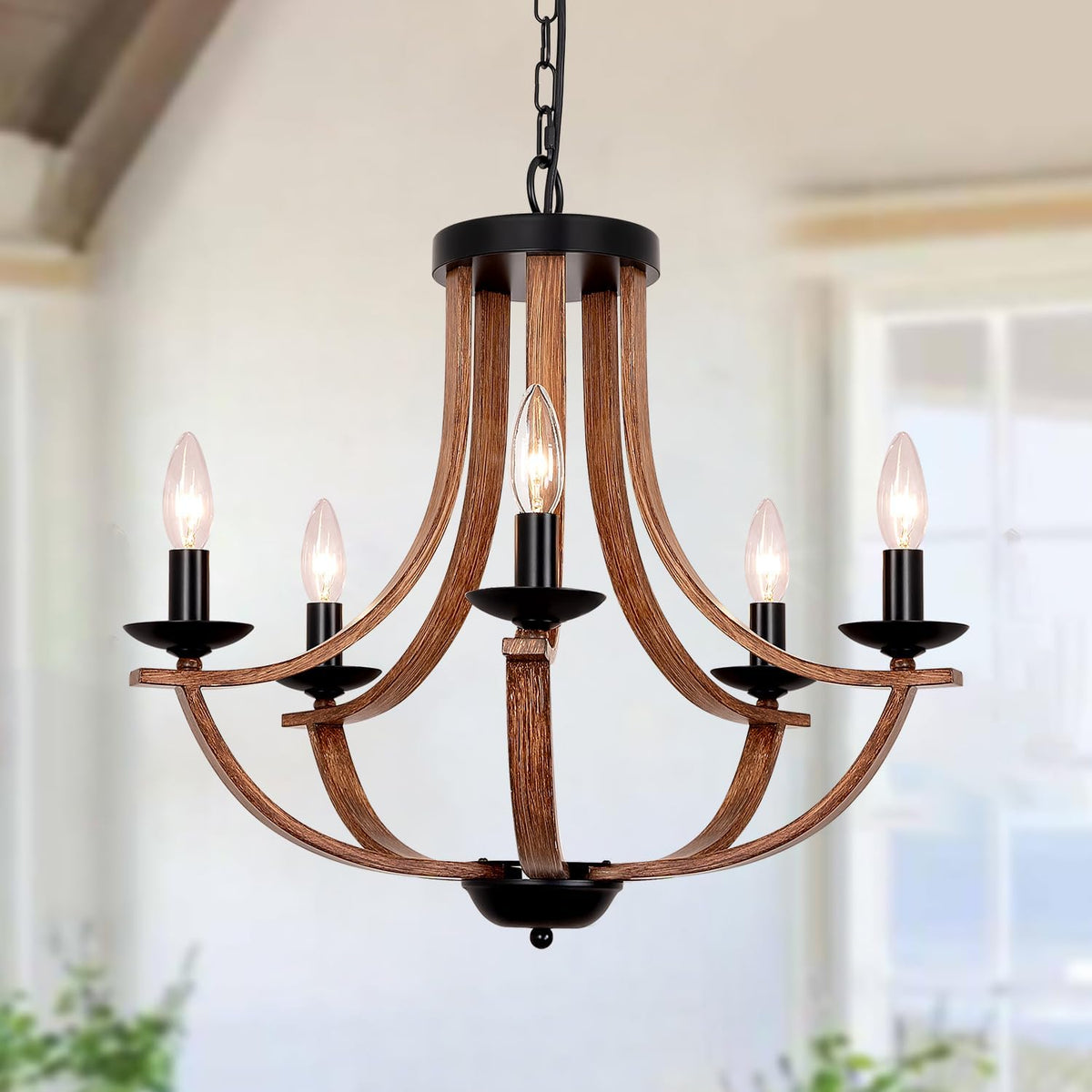 Front view of a warm wood-finish chandelier with five upward curved slats and black candle holders