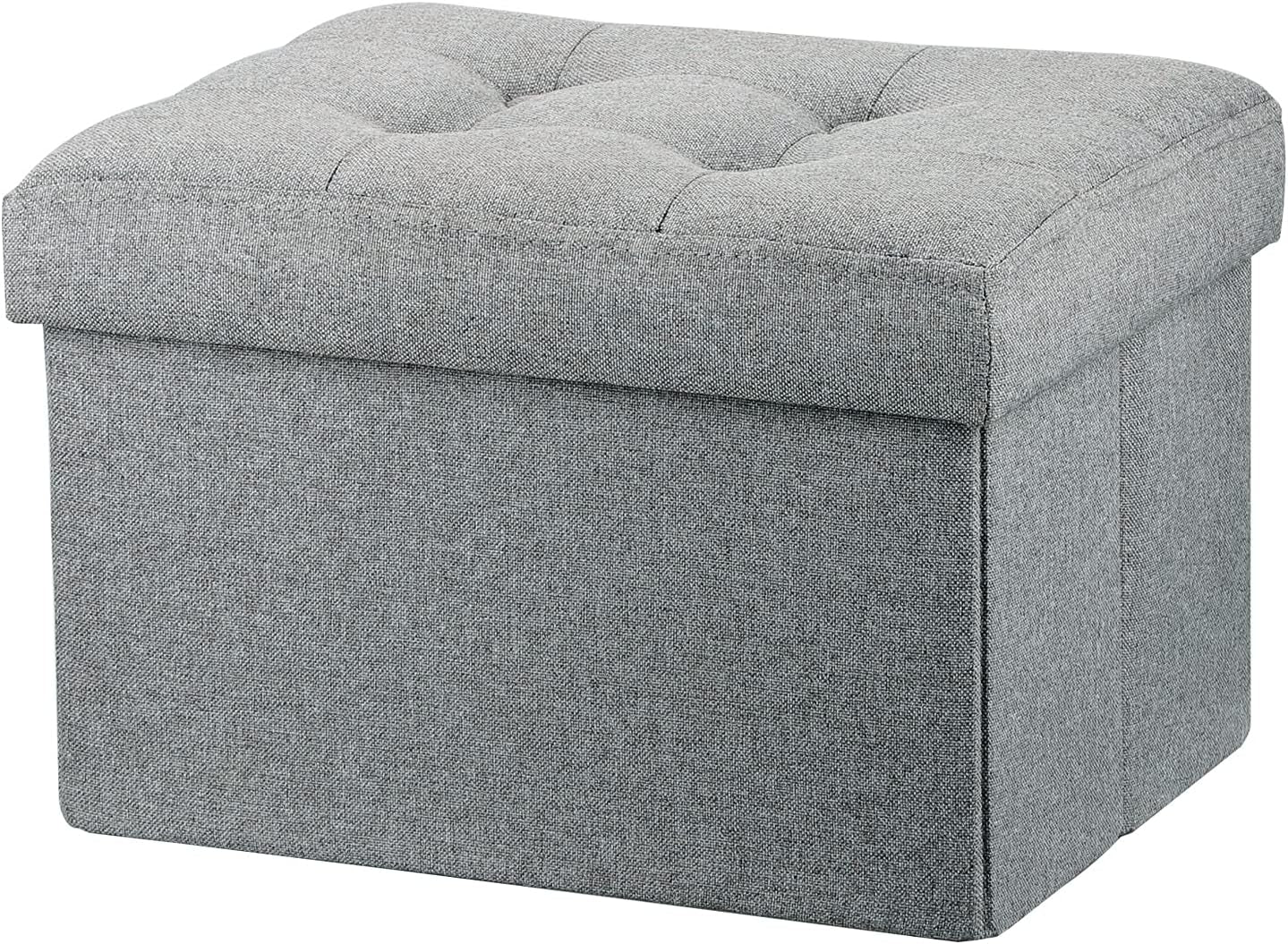 Three-quarter front view of a tufted light gray fabric storage ottoman showing textured upholstery.