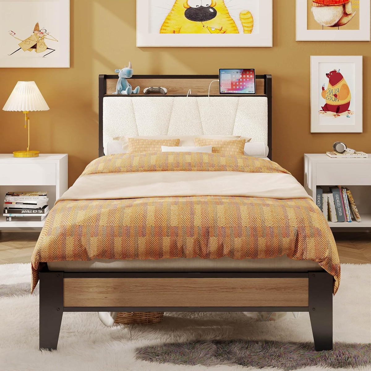 Front view of a light textured white headboard with a wood shelf holding a tablet and small toys.