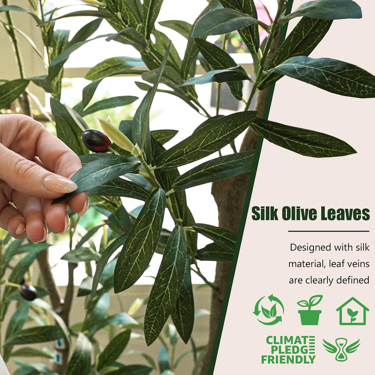 Close-up of silk-blend olive leaves and a handcrafted olive held by a hand showing detailed leaf veins