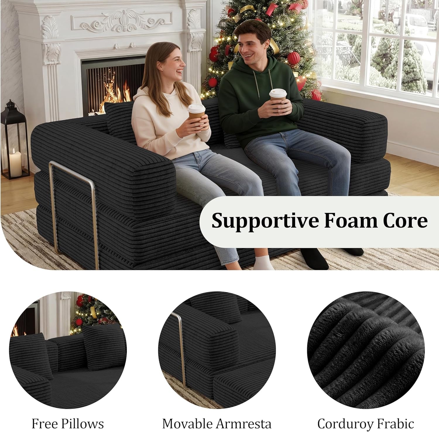 Two people seated on the black corduroy convertible sofa showing foam core comfort and armrests