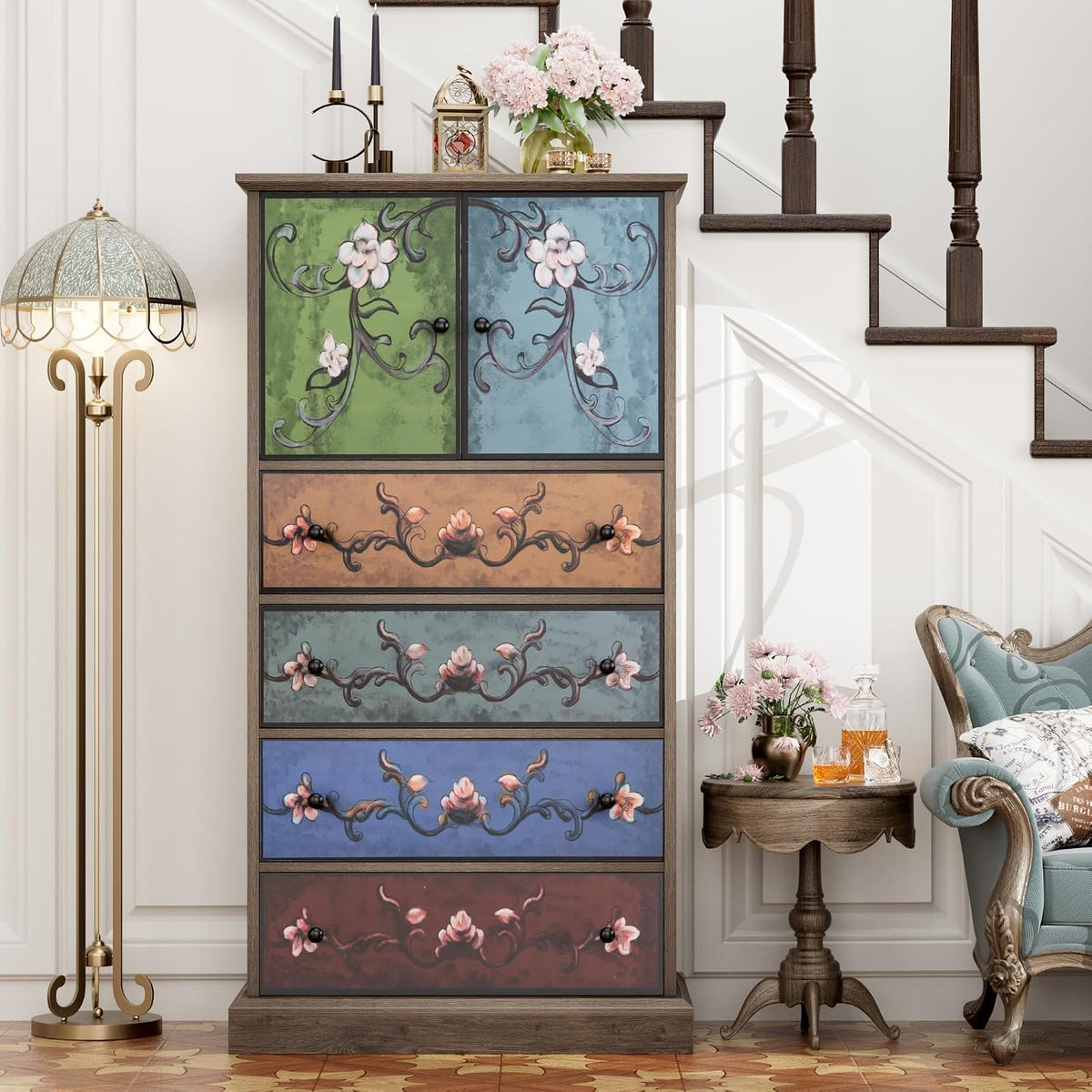 Tall floral-paneled dresser near a stairway, front view showing the raised base and multicolored drawers