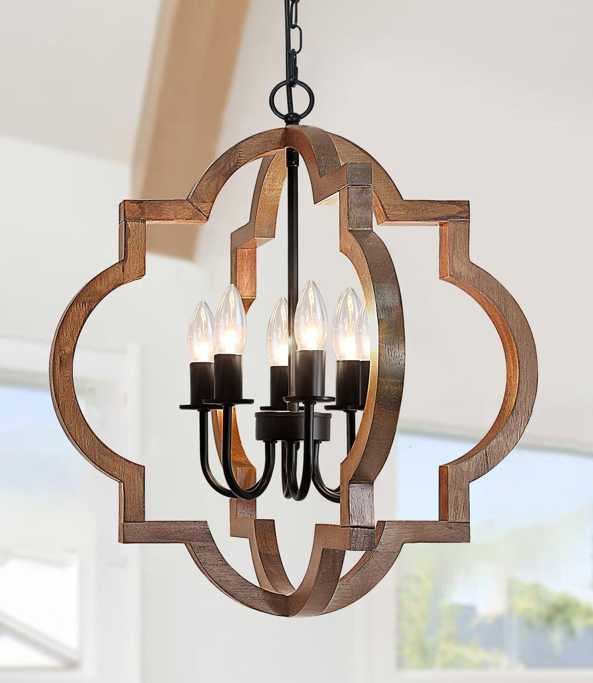 Front close-up of distressed light-wood orb showing inner black candle arms and five lit bulbs.