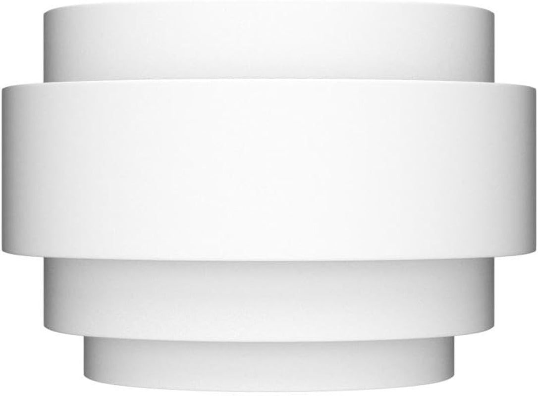 White half-moon metal wall sconce side view on white background showing stepped layered profile
