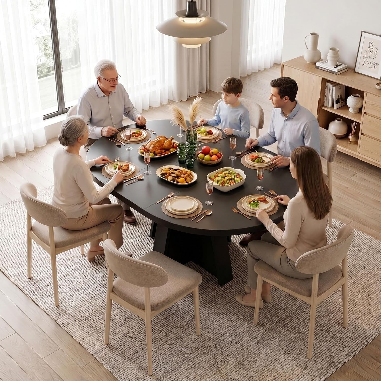 Overhead lifestyle image of the table set for a meal with six people seated around the expanded tabletop