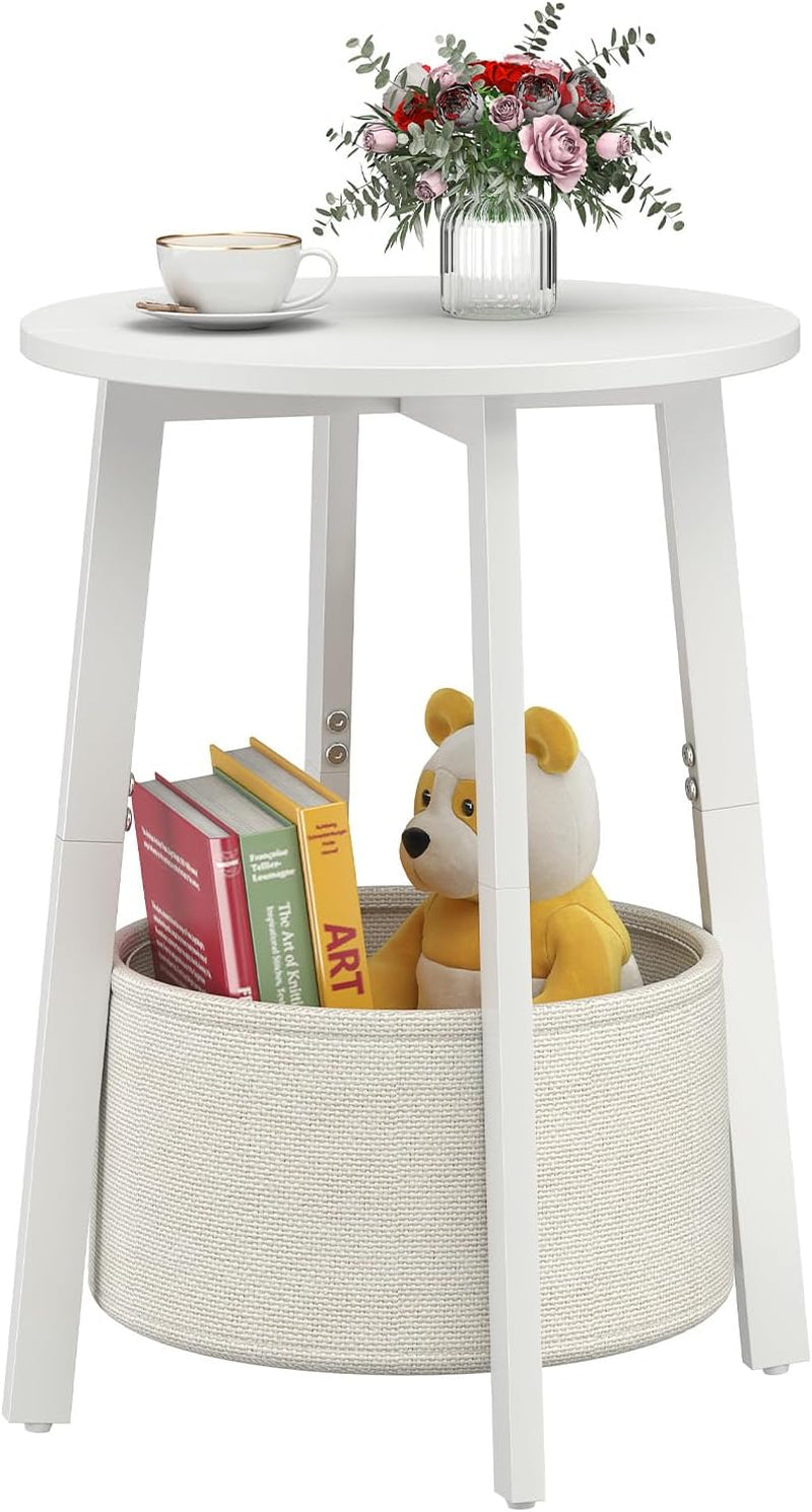 Single white round side table with white legs and a cream cloth basket holding books and a teddy bear.