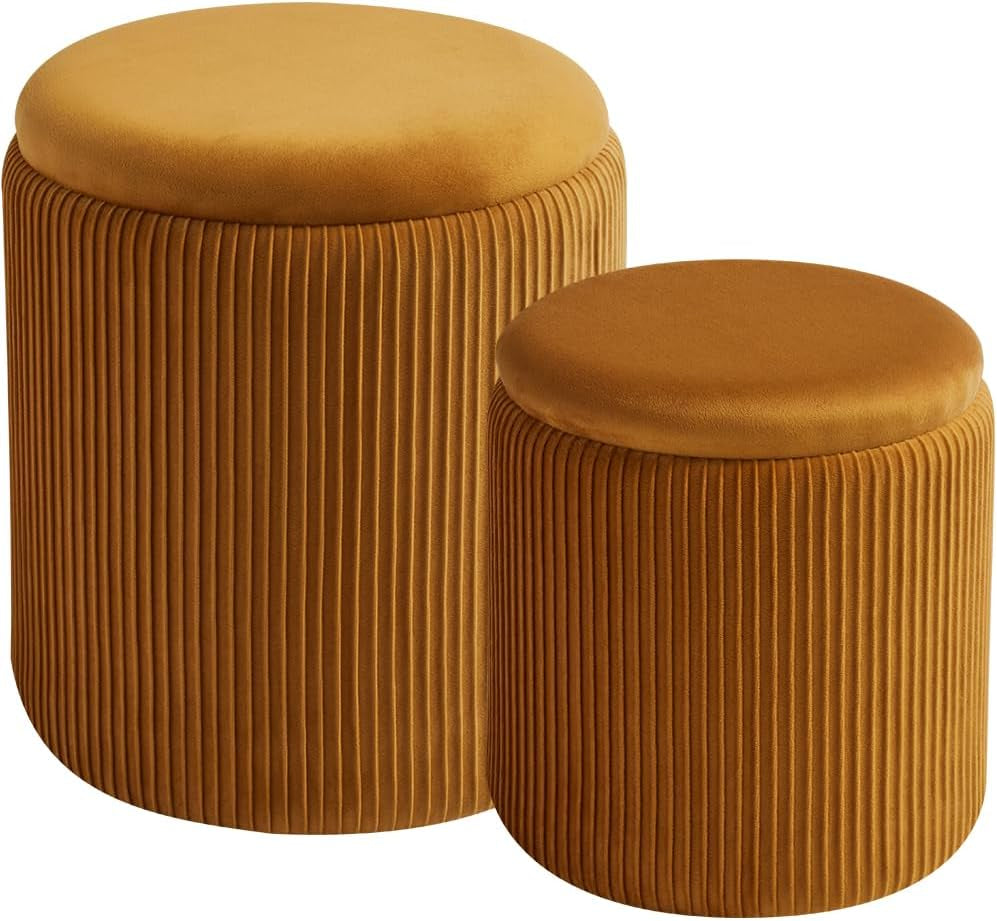 Pair of mustard yellow round ottomans with vertical pleats shown against a white background