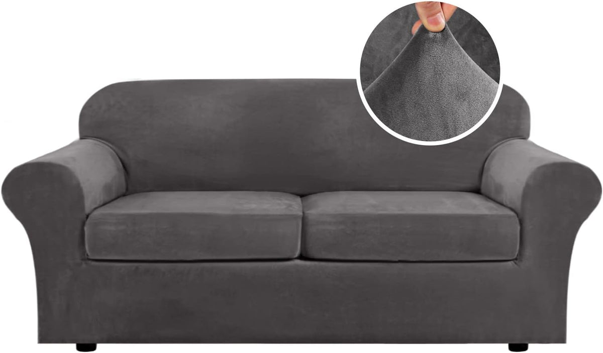 Charcoal gray three-seat sofa front-facing, low black feet visible and circular close-up of the fabric being pinched