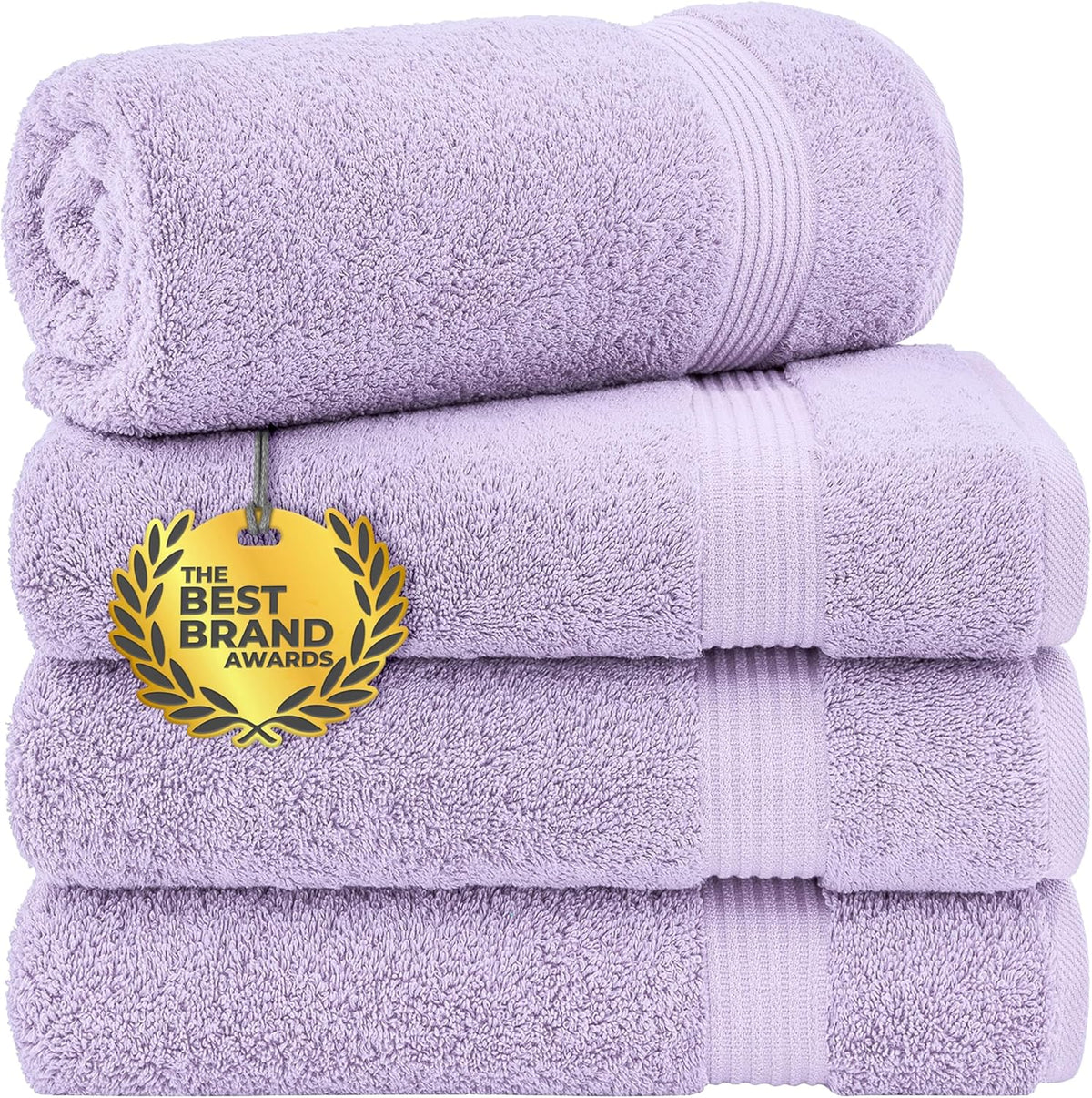 Stack of four rolled and folded pale lavender towels with a gold award tag hanging on front